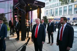 Trump having dinner at a restaurant near the White House to promote his Washington crackdown